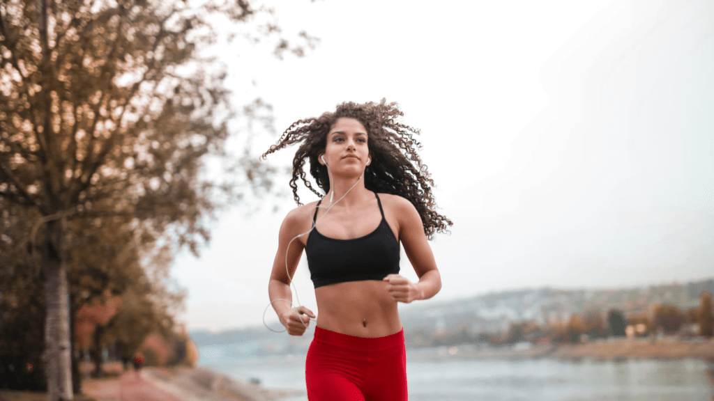 Woman in black sports bra running